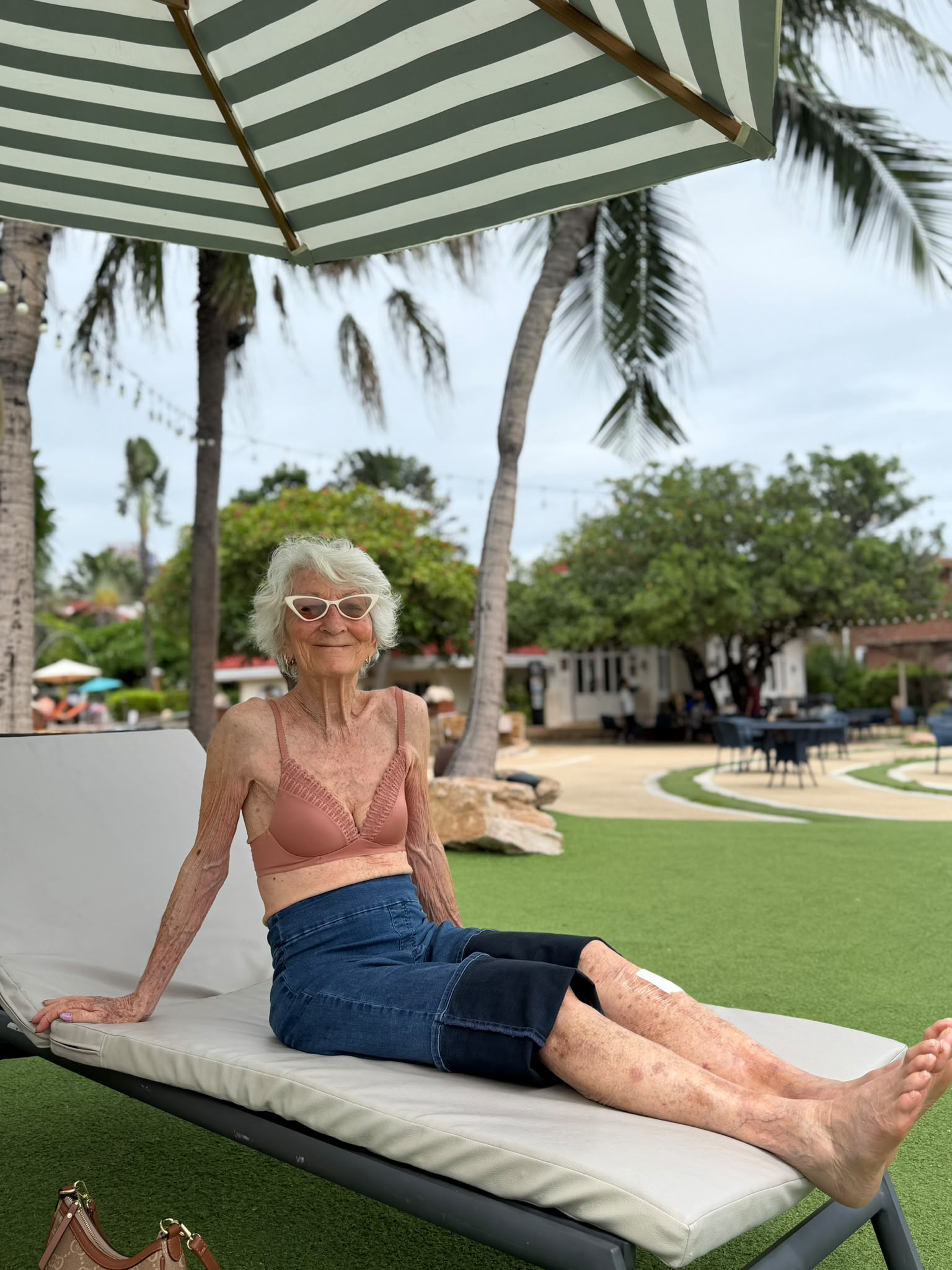 Homerly resident relaxing on a lounge chair on the lawn in Hua Hin